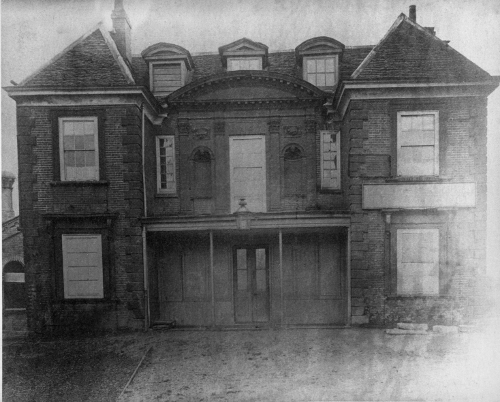 Clarke’s Academy, before demolition in 1872, after serving as a railway station;
        photo by E. E. Leggatt at the Victoria & Albert Museum (no.324-1907) and via the Enfield
        Society.* Click to enlarge.